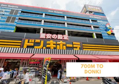 a building with a sign that reads zoom to donk at COMMA HOUSE Kitaikebukuro 302 in Tokyo