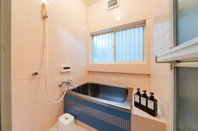 a bathroom with a sink and a toilet at 4-chome House Senju 1F - Cozy Japanese-Style Apartment, 8 min to Kita-Senju in Tokyo
