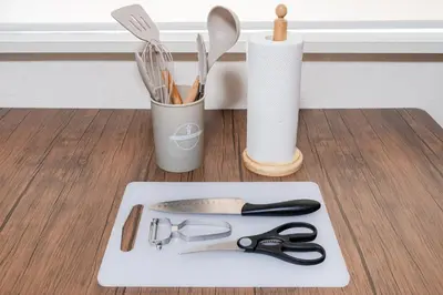 a white cutting board with scissors and utensils at 4-chome House Senju 1F - Cozy Japanese-Style Apartment, 8 min to Kita-Senju in Tokyo
