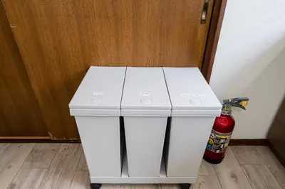 a white refrigerator with a fire extinguisher next to it at 4-chome House Senju 2F - Cozy Japanese-Style Apartment, 8 min to Kita-Senju in Tokyo