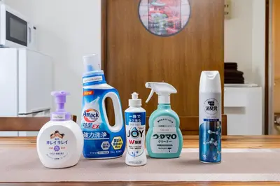 four bottles of cleaning products sitting on a counter at 4-chome House Senju 2F - Cozy Japanese-Style Apartment, 8 min to Kita-Senju in Tokyo
