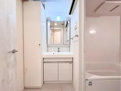 a bathroom with a sink and a mirror at P O IN T - Okachimachi Akihabara Designer's Home in Tokyo