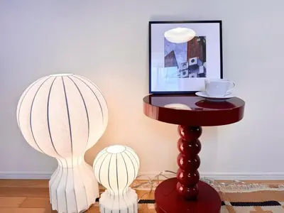 a table with two lamps and a picture on the wall at P O IN T - Okachimachi Akihabara Designer's Home in Tokyo