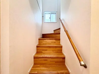a staircase with wooden floors and a window at P O IN T - Okachimachi Akihabara Designer's Home in Tokyo