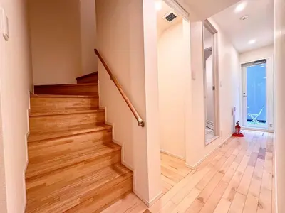 an empty hallway with a staircase in a house at P O IN T - Okachimachi Akihabara Designer's Home in Tokyo