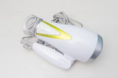 a white electric hair dryer on a white table at Tsubaki in Tokyo