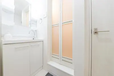 a bathroom with a shower and a sink at Tsubaki in Tokyo