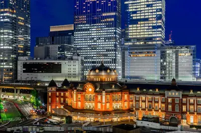 a lit up building in a city at night at OPEN! TOKYO Kitasenju A Newly built stylish room! in Tokyo