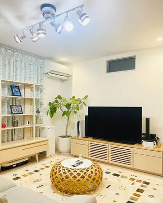 a living room with a flat screen tv and a table at Alo BnB 7 - Near IKEBUKURO, SHINJUKU, UENO - Self Check in - OYAMA Sta 3min in Tokyo