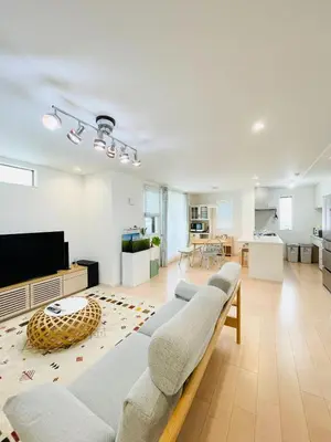 a living room with couches and a flat screen tv at Alo BnB 7 - Near IKEBUKURO, SHINJUKU, UENO - Self Check in - OYAMA Sta 3min in Tokyo