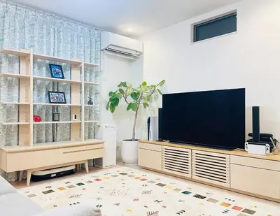 a living room with a flat screen tv on a entertainment center at Alo BnB 7 - Near IKEBUKURO, SHINJUKU, UENO - Self Check in - OYAMA Sta 3min in Tokyo