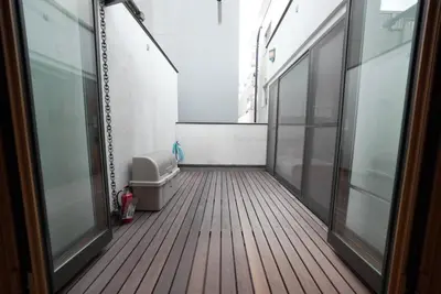 an empty hallway with a toilet in a room at Buddy Resort Kagurazaka in Tokyo