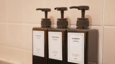 a group of three bottles of soap in a bathroom at Buddy Resort Kagurazaka in Tokyo