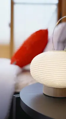 a stack of white plates sitting on top of a table at Buddy Resort Kagurazaka in Tokyo
