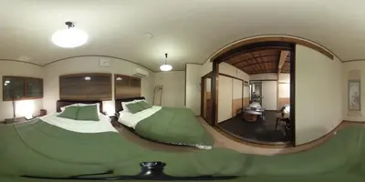a bedroom with a large bed and a large mirror at Buddy Resort Kagurazaka in Tokyo