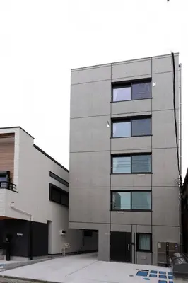 a gray building with windows on the side of it at YXD102 Direct Skytree convenience facilities in Tokyo