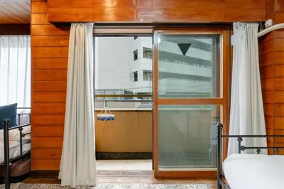 a sliding glass door in a room with a window at -Blue sky4F- \u4e09\u30ce\u8f2a\u30ea\u30d3\u30f3\u30b0\u5e83\u3044\u3086\u3063\u305f\u308a\u533a\u9593\u30b7\u30f3\u30d7\u30eb\u306a\u7d20\u6575\u306a\u73cd\u3057\u3044\u5e83\u3044\u304a\u5bb6 in Tokyo
