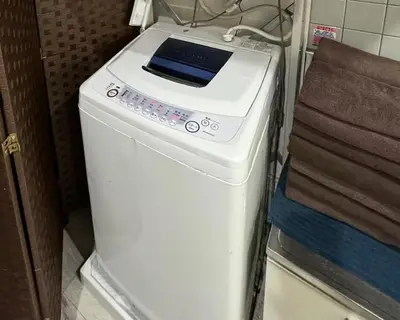 a washing machine with a tablet on top of it at Pro Kitchen and Karaoke 100sqm amusement hotel in Tokyo