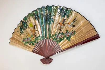 a wooden umbrella with trees and insects on it at Ciel\u5357\u9ebb\u5e03 in Tokyo