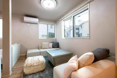 a living room with a couch and a table at Ciel\u5357\u9ebb\u5e03 in Tokyo