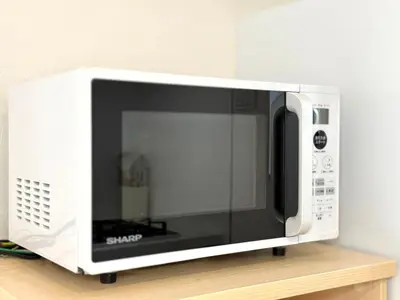 a microwave oven sitting on top of a shelf at Katsushika House\u67f4\u53c8 KS0340 in Tokyo