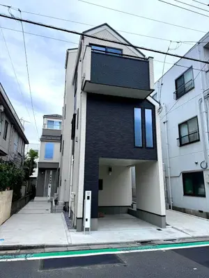 a black and white building on a city street at Katsushika House\u67f4\u53c8 KS0340 in Tokyo