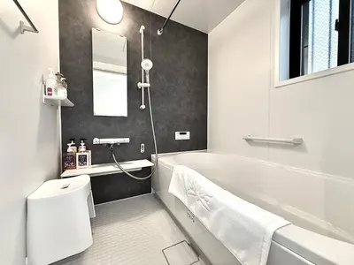 a bathroom with a white tub and a sink at Katsushika House\u67f4\u53c8 KS0340 in Tokyo