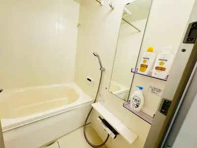 a bathroom with a sink and a bath tub at Ikebukuro House-TS0378 in Tokyo