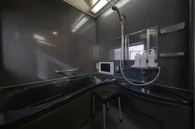 a black bathroom with a sink and a mirror at \u30d7\u30e9\u30a4\u30e0\u30c6\u30e9\u30b9\u4e0a\u6c60\u53f05\u4e01\u76ee in Tokyo