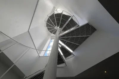a spiral staircase in a building with a window at \u30d7\u30e9\u30a4\u30e0\u30c6\u30e9\u30b9\u4e0a\u6c60\u53f05\u4e01\u76ee in Tokyo
