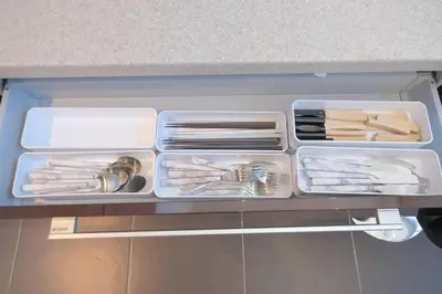 a drawer filled with plates and utensils at \u30d7\u30e9\u30a4\u30e0\u30c6\u30e9\u30b9\u4e0a\u6c60\u53f05\u4e01\u76ee in Tokyo