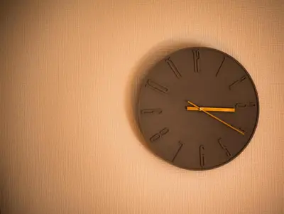 a black clock hanging on a wall at \u30b5\u30f3\u30e2\u30fc\u30eb\u30af\u30ec\u30b9\u30c8306 in Tokyo
