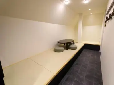 a waiting room with a table and two stools at Chaan Ueno Hotel - Vacation STAY 01162v in Tokyo