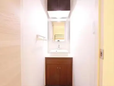 a bathroom with a sink and a mirror at Chaan Ueno Hotel - Vacation STAY 01162v in Tokyo