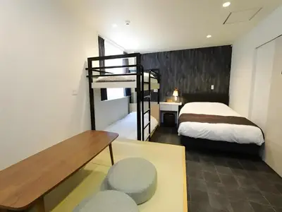 a bedroom with a bed and a bunk bed at Chaan Ueno Hotel - Vacation STAY 01152v in Tokyo
