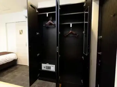 a black closet with hangers in a bedroom at Chaan Ueno Hotel - Vacation STAY 01159v in Tokyo