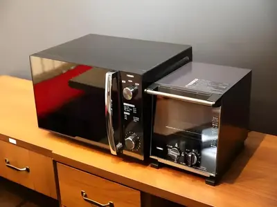 a black toaster oven sitting on top of a counter at Chaan Ueno Hotel - Vacation STAY 01159v in Tokyo