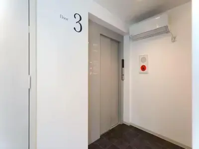 a hallway with a door with the number three on it at Chaan Ueno Hotel - Vacation STAY 01157v in Tokyo