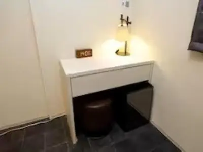 a bathroom with a white sink and a stool at Chaan Ueno Hotel - Vacation STAY 01157v in Tokyo