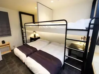 a bedroom with two bunk beds and a ladder at Chaan Ueno Hotel - Vacation STAY 01157v in Tokyo