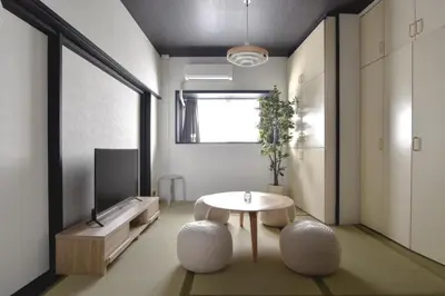 a living room with a table and a tv at Okada Building - Vacation STAY 18449 in Tokyo