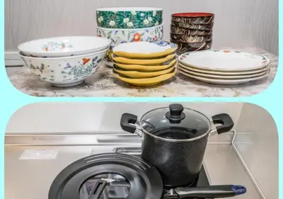 a counter with plates and a pot on a stove at Qiao318,Mejiro - Vacation STAY 20385v in Tokyo