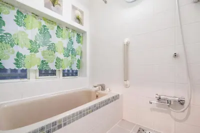 a bathroom with a tub and a window at Qiao318,Mejiro - Vacation STAY 20385v in Tokyo