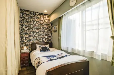 a small bedroom with a bed and a window at Qiao318,Mejiro - Vacation STAY 20385v in Tokyo