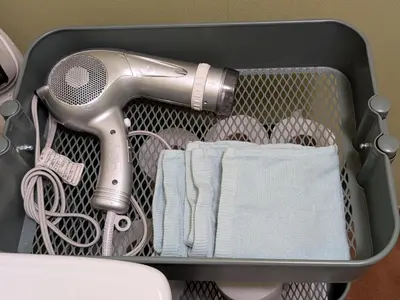 a suitcase with a hair dryer and a hair drier at \u6771\u4eac\u306e\u4e2d\u5fc3\u5730 Okachimachi Staypia in Tokyo