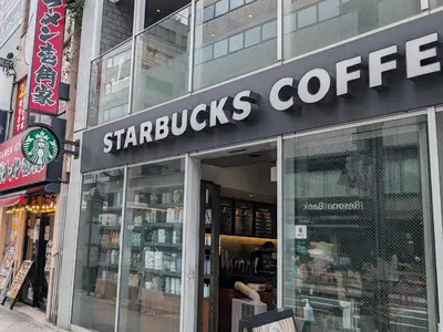 a starbucks coffee store on a city street at \u6771\u4eac\u306e\u4e2d\u5fc3\u5730 Okachimachi Staypia in Tokyo