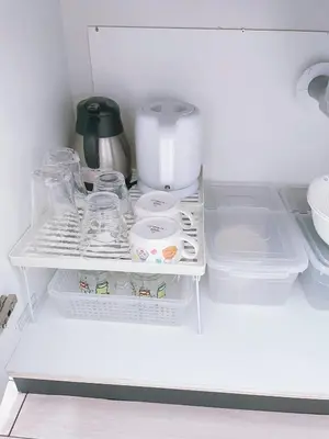 a white refrigerator filled with dishes and a coffee maker at \u7d50\u5948\u5e0c Yunakis House in Tokyo