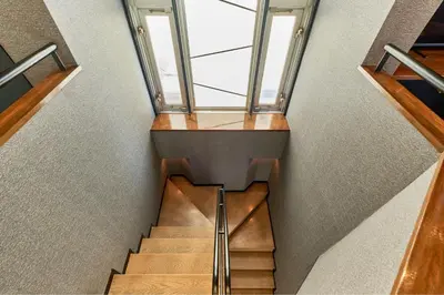 a staircase in a house with a glass ceiling at ACOE Higashi-Shinjuku Gourmet Area in Tokyo