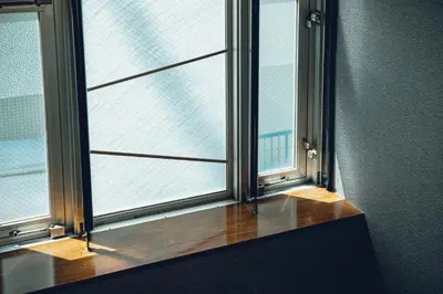 an open window with a view of a building at ACOE Higashi-Shinjuku Gourmet Area in Tokyo