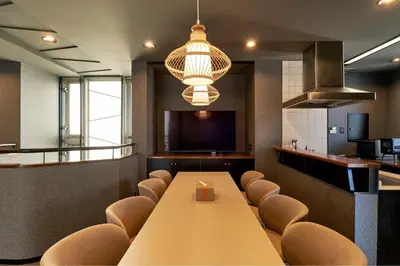 a conference room with a long table and chairs at ACOE Higashi-Shinjuku Gourmet Area in Tokyo